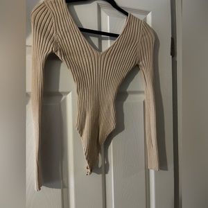Cream bodysuit from Laura’s boutique